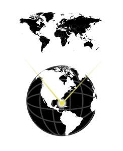 A lightbulb centered on a globe radiates light on a flat surface,